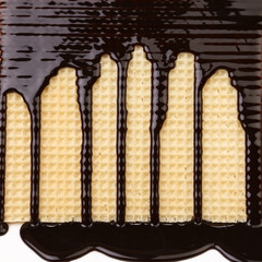 Background of wafer. Stream chocolate.