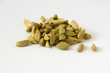 cardamon seeds on white background