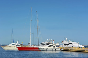Fototapeta premium White motor yacht over harbor pier, Odessa, Ukraine