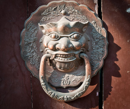 lion head door knocker in hutong area in Beijing, China