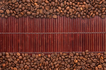 Coffee beans lying on a bamboo mat