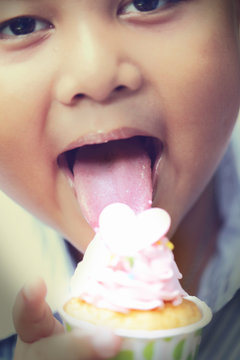 Asian Boy Eating Cake