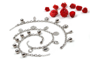 costume jewerly and red flowers