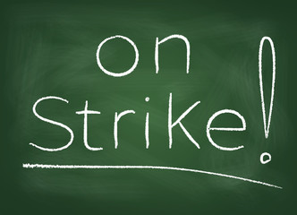 The school board on which is written in chalk "on strike"