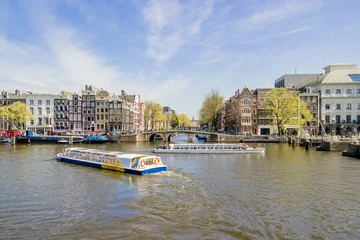 Fotobehang View on houseboats, Amsterdam, the Netherlands © tetyanaustenko