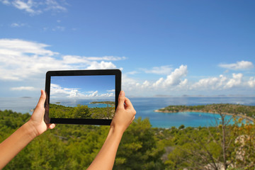 Girl taking pictures on a tablet