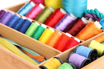 Sewing accessories in wooden box close up