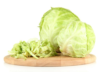 Green cabbage sliced on cutting board, isolated on white