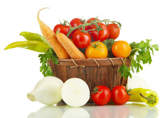 Fresh vegetables in basket isolated on white