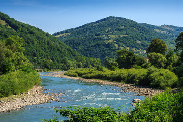 Fototapeta na wymiar River meanders at the mountain foot