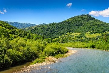 Fototapeta na wymiar River turns and goes to the mountains