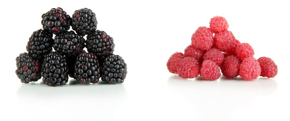 Ripe raspberries and blackberries isolated on white