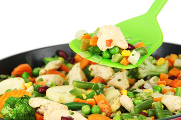 Casserole with vegetables and meat on pan, isolated on white