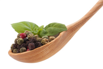 Pepper seasoning  mix in wooden spoon isolated on white backgrou