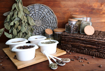 Assortment of spices in  white spoons and bowls,