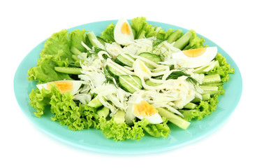 Delicious salad with eggs, cabbage and cucumbers, isolated
