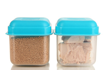 Dry yeast in containers isolated on white