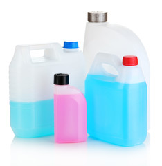 Different liquids for car in canisters isolated on white