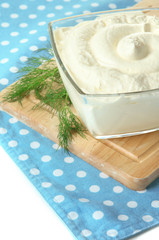 Sour cream in bowl close-up