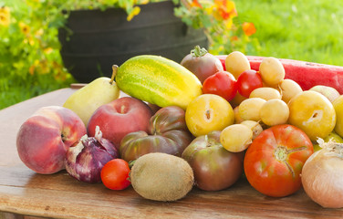 Healthy fruits and vegetables on table