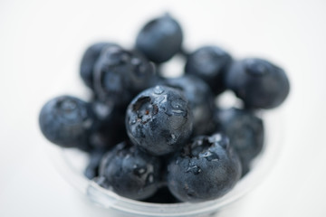 Ripe blueberries covered with dew, macro shot