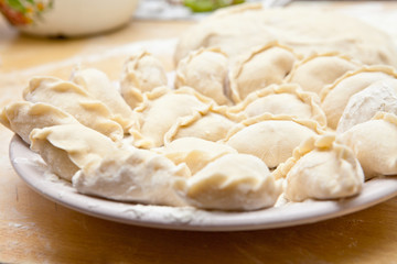 Fototapeta na wymiar uncooked dumplings on the table