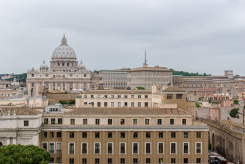 Fototapeta na wymiar Buildings of Rome with Vatican St Peter Dome in background