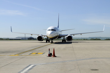 Jet aircraft approaching the airport stand