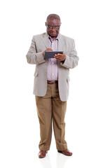 senior african man using tablet computer