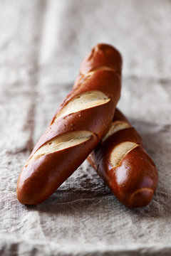 Two Pretzel Sticks On Linen Cloth