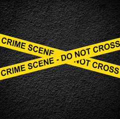 CRIME SCENE - DO NOT CROSS against black wall