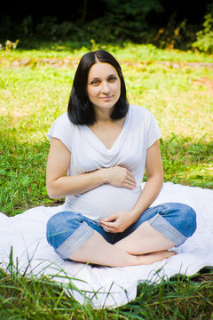 Pregnant woman on a meadow