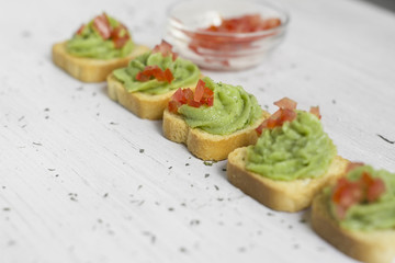 toast, guacamole and tomato