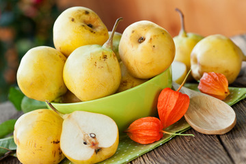 Fototapeta na wymiar ripe pears in green bowl, in close up