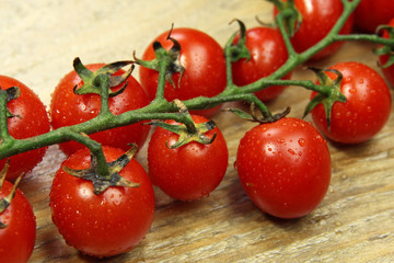 fresh tomatoes on wooden background