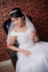 Bride posing in wedding dress at studio