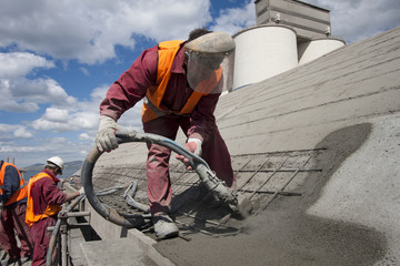 Renewing roof of industrial hale with sprayed concrete - obrazy, fototapety, plakaty