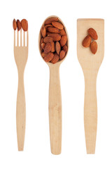 Wooden spoon,fork, shovel with almonds