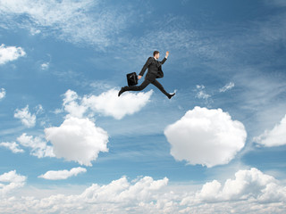 Fototapeta na wymiar man jumping from cloud