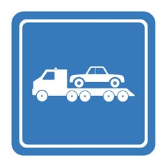 Camion de dépannage dans un panneau