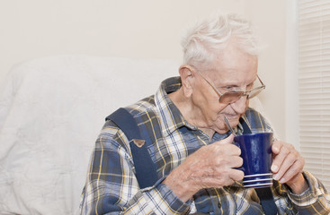 Elderly Man Drinking From Cup