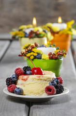 Vanilla cake decorated with fresh fruits. Selective focus