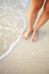 Fototapeta na wymiar Legs on the beach.
