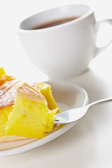 Cake and tea on white