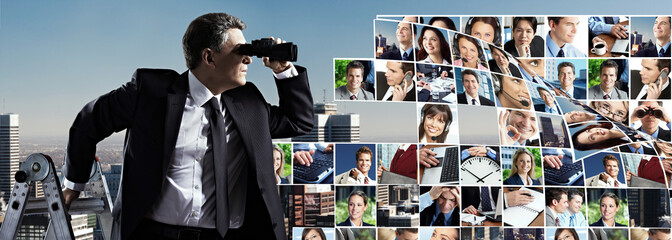 Businessman with binoculars.