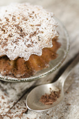 Pumpkin muffins on saucer, blurred background