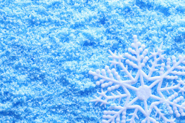 Snowflake in snow