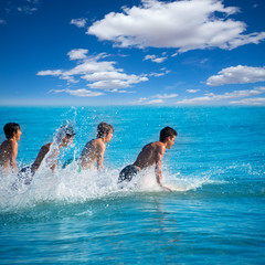 Boys surfers surfing running jumping on surfboards