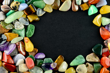 Closeup colorful stones on black background