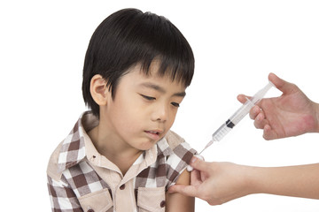 doctor give injection to boy